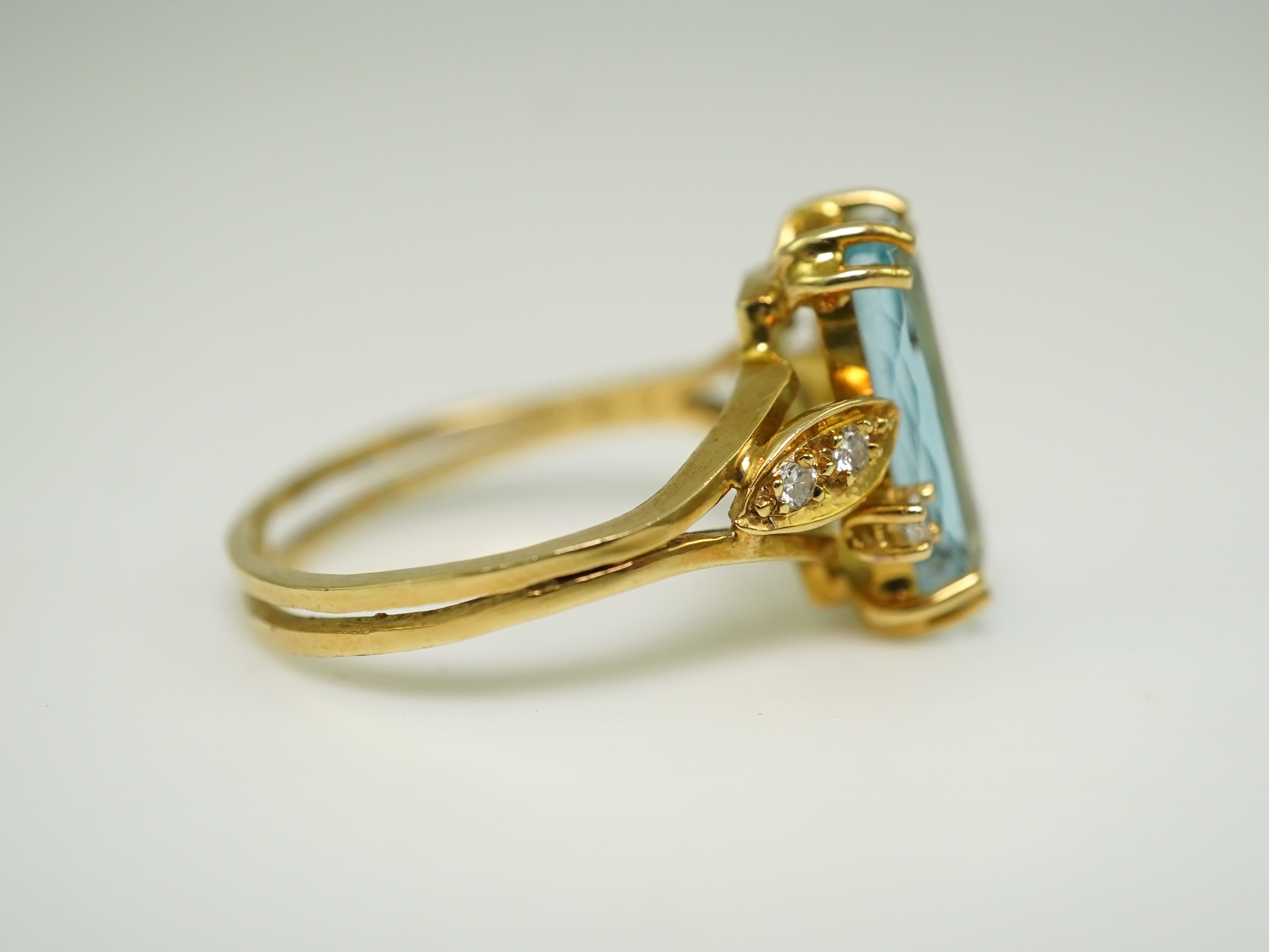 An aquamarine and diamond ring